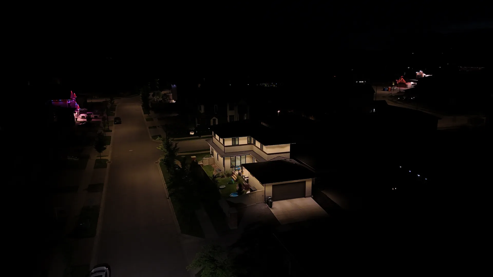 Aerial drone view of permanent LED roofline lighting installed on a home in Edmonton, Alberta